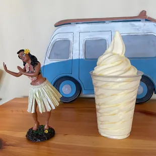 a figurine of a hula girl and an ice cream cone