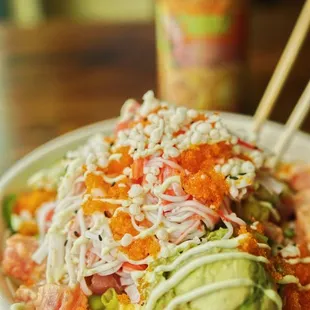 a plate of food with chopsticks