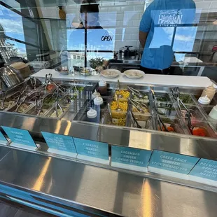 a man standing behind the counter