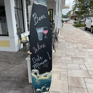 a surfboard with a message on it