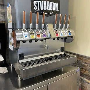 a stainless steel counter top with a beer dispenser