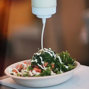 a salad in a bowl with dressing