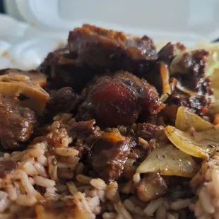 a plate of rice and meat