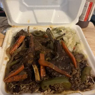 a styrofoam container of beef and vegetables