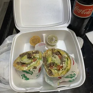 a tray of food and a bottle of soda