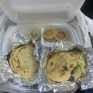 two quesadillas wrapped in aluminum foil