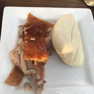 Chinese style roast pig in steamed bao bun w/assorted herbs/sauces