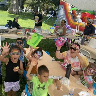 Happy kids with face painted, some had it on arm or leg or glitter tattoo.
