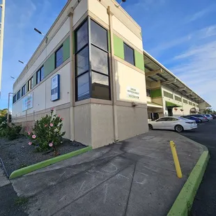 Corner of the building. Entrance is by the 2 red lanterns in the parking lot.