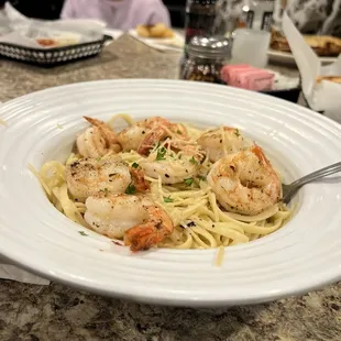 a plate of pasta with shrimp