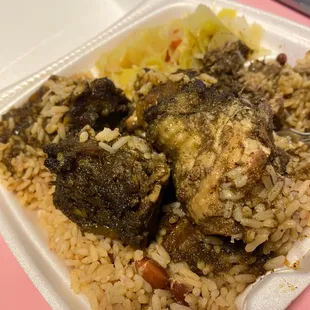chicken and rice in a styrofoam container