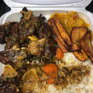 Jerk Chicken, steamed White Rice and our Famous Steam Cabbage