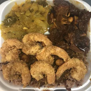 Oxtails and rice and peas W/ a side of shrimp and cabbage