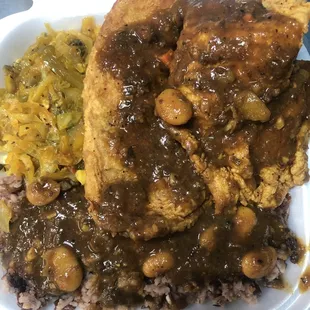 Fried Tilapia w/ rice &amp; Peas and oxtail Gravy and a side of Steam Cabbage.
