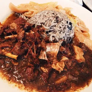 Goat curry with rice and signature cabbage.