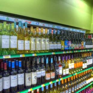 rows of bottles of wine on shelves