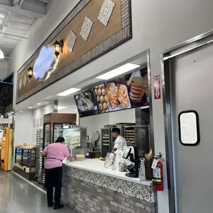 a woman standing at the counter