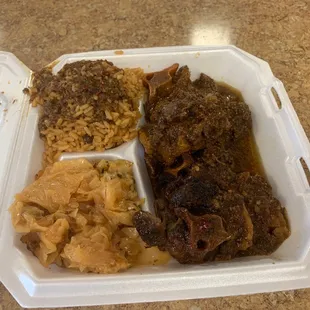 Oxtails.  Rice and peas and cabbage.  Just amazingly good.  True Carribean flavor.