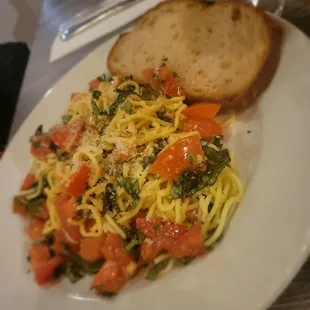 a plate of pasta and bread