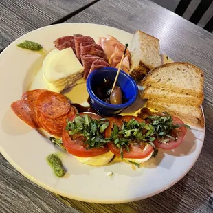 Happy hour charcuterie meat plate. This was great. Minus the microscopic pesto in the outer edge.