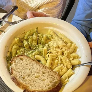My son had a penne with pesto and olio. He did not like it. He said it was flavorless. It came with a random cold slice of bread.