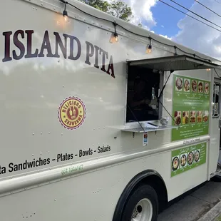 a food truck parked on the side of the road
