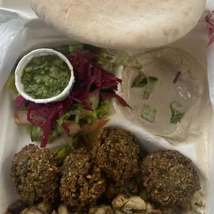 Love this. She let me jane the combo of falafel and chicken sharwma . Comes with a nice and fluffy pita bread.