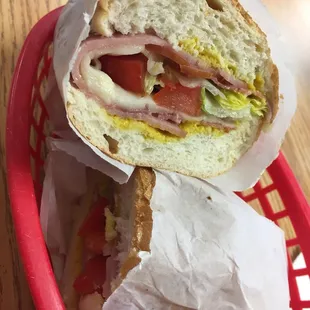 a half of a sandwich in a basket