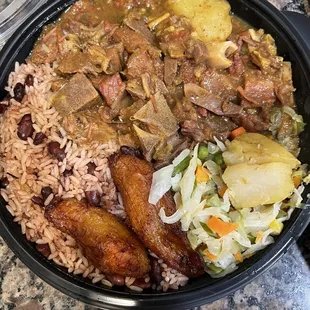 Curry goat with rice and beans