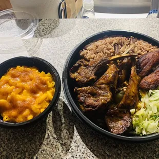 Roasted Rack of Lamb Mac and Cheese with Fried Plantains, cabbage, Rice and Peas