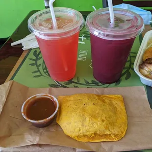 Strawberry drink, beet drink, and Jamaican patty.
