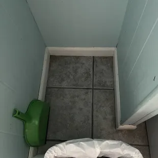 Unidentified something that was spilled and never mopped. Smelled of rancid garbage.