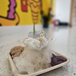 Half serving of the Jasmine tea shace ice with taro, ube, coconut cream, and butterfly tea jello.