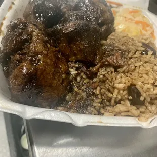 Oxtails, Sauteed Cabbage, Rice and Peas Island Spice Style