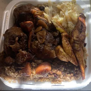 Large Oxtails served with Rice and Peas, Cabbage, and Plantains