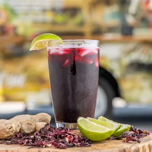  glass of red wine with lime and gingers