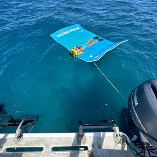 Kids snorkeling on our floating magic carpet