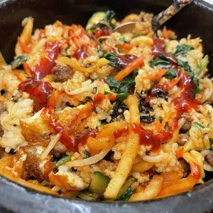 Hot sizzling stone pot  bibimbap with kogujaung sauce...