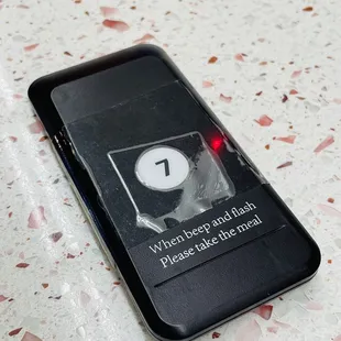 a phone with a button on it