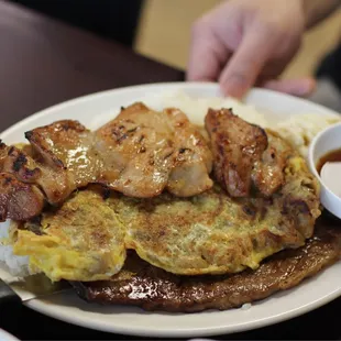 Combo plate of teriyaki chicken, meat junand galbi. All delicious!