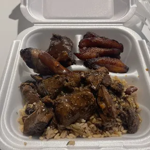 Grilled Jerked Chicken with rice and beans, and Plantains