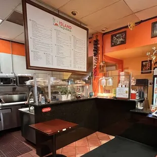 a man in a wheelchair at the counter