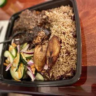 Bolt (Jerk Chicken) and Jamrock (Oxtail) with salad
