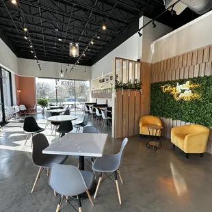 a dining area with tables and chairs