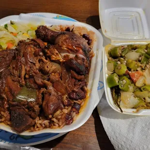 Brown stew chicken, peas and rice with oxtail gravy, cabbage, and a side of okra.