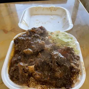 Oxtail, red beans and rice and cabbage.