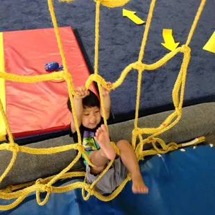 Loves climbing the rope wall