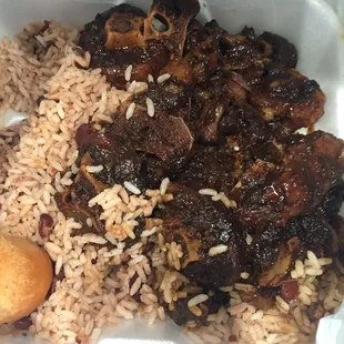 Oxtail plate from Caribbean sushine bakery- glistening oxtails, balanced flavors, rice and beans were delicious