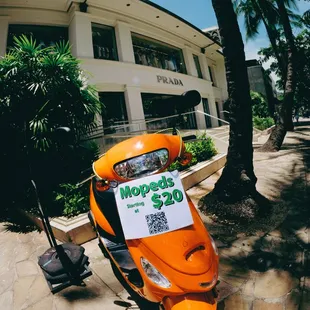 One of our display mopeds at one of our convenient pickup locations in Waikiki!