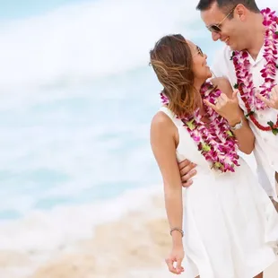 Newly weds sporting Raybans add a touch of style to their Waimanalo Bay beach wedding.